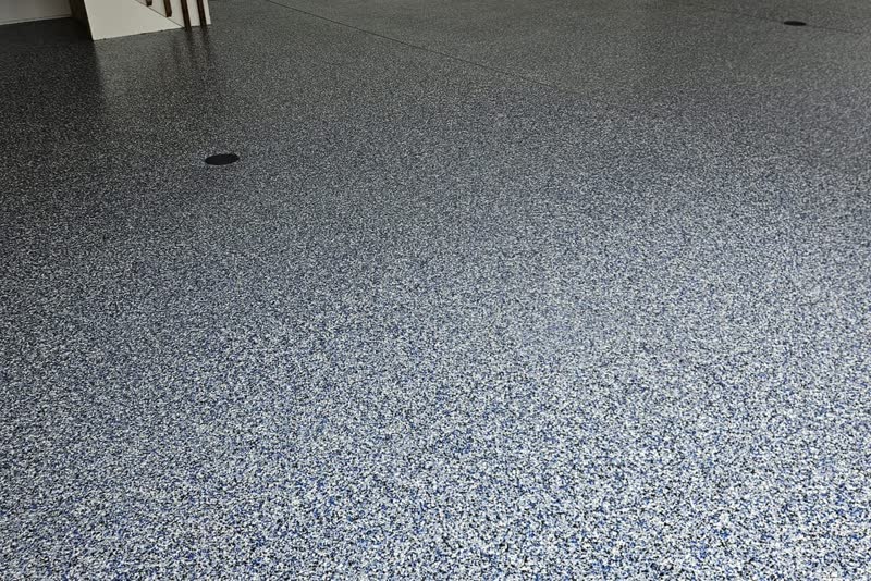 Polyurea garage floor coating with custom decorative flake in a SW Twin Cities garage