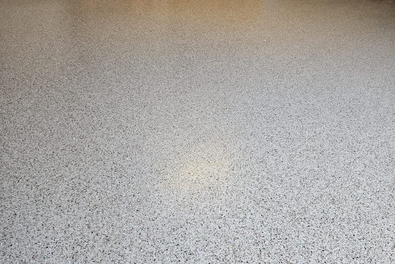 Garage floor in warm flake palette installed in SW Twin Cities residential garage