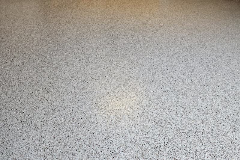 Prior Lake garage floor finished in polyurea with a decorative flake blend