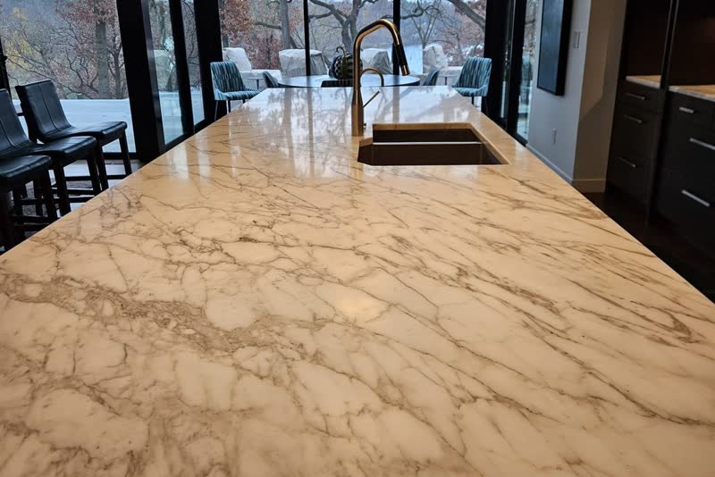 Natural stone kitchen island after edge re-polishing and reseal